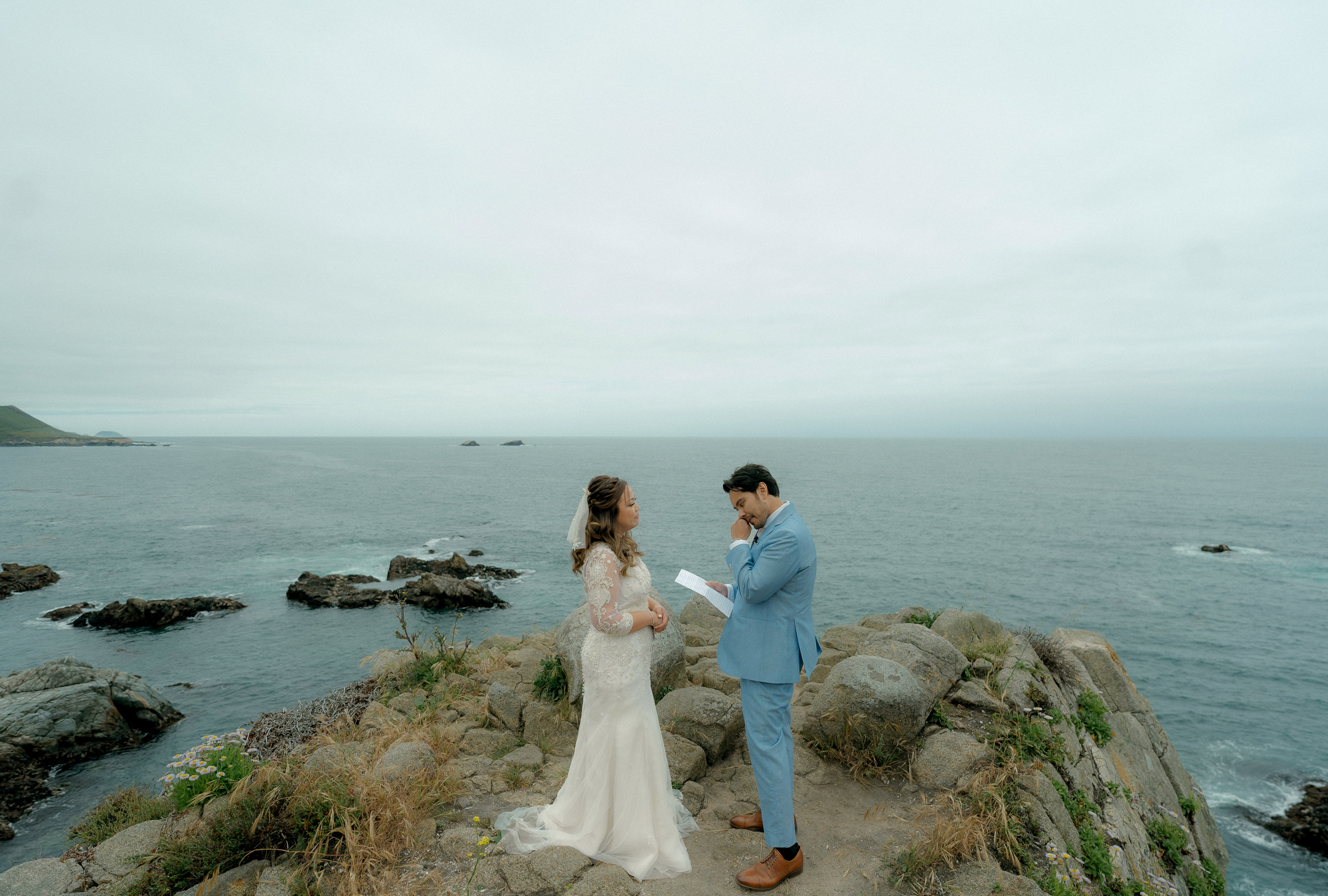 Kris and Tracey's private vows at the cliff's edge, gazing out at the beauty of Monterey Bay.